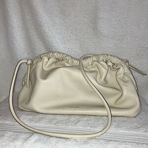 I am selling Mansur Gavriel, it is the color oyster. It is a crossbody bag.